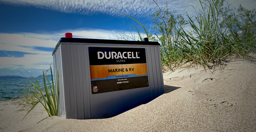 Duracell Marine battery sitting on a beach