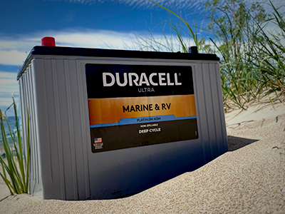Duracell Marine battery sitting on a beach
