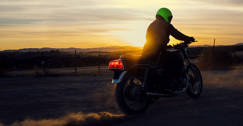 Riding a motorcycle at sundown