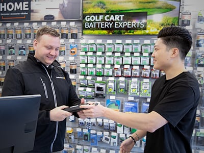 employee talking to a customer about recycling