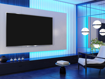 Blue lit room with a tv and mirror wall