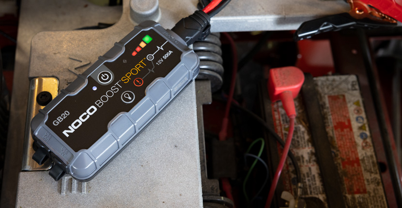 Using a charger to charge a lawn mower battery
