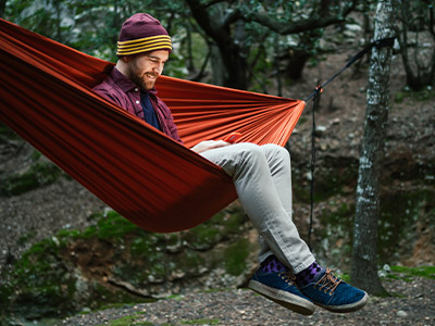 person sitting in a red hammock