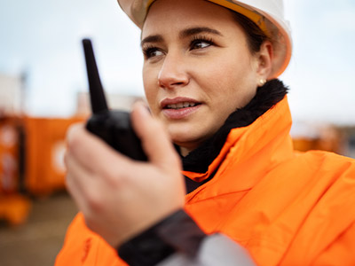 construction worker on a walkie talkie