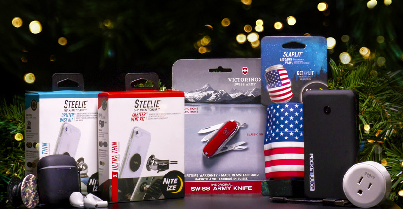 A Steelie Orbiter dash kit, Steelie Orbiter vent kit, air pods, swiss army knife, SlapIt American flag can Koozie, PocketJuice portable charger, and an outlet converter