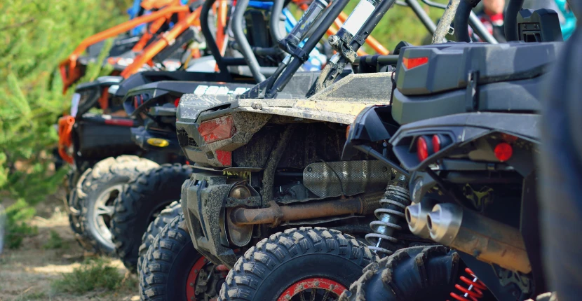 Multiple off-road vehicles lined up