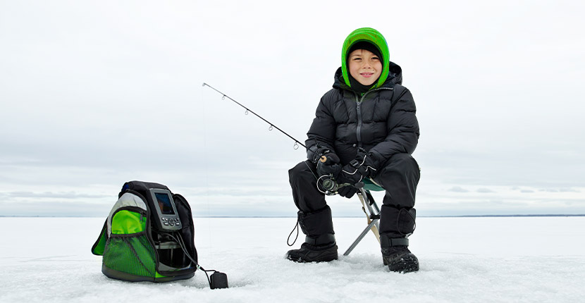 young child ice fishing.