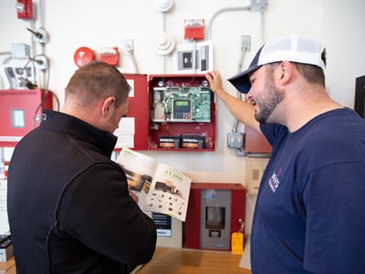 Employee explaining to a customer what we can do for them