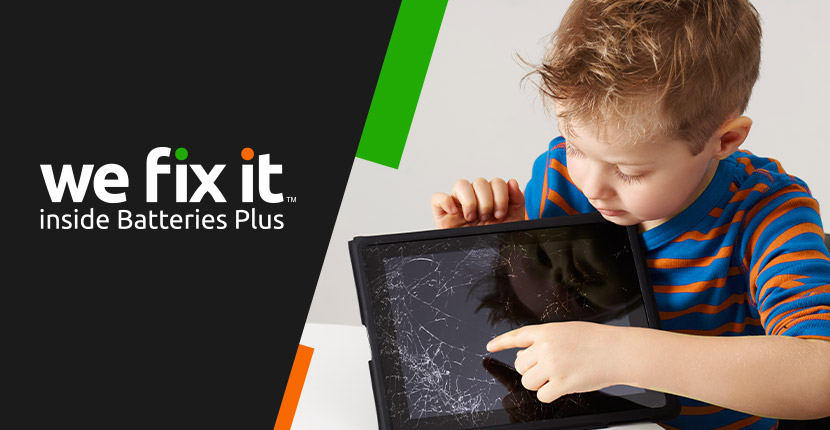 Little boy looking at cracked tablet screen. we fix it inside Batteries Plus