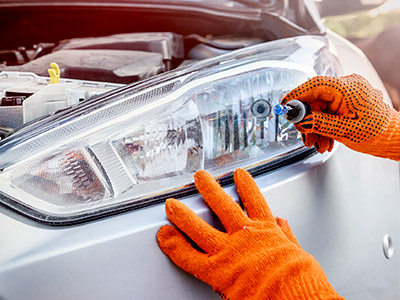 replacing a headlight of a white vehicle