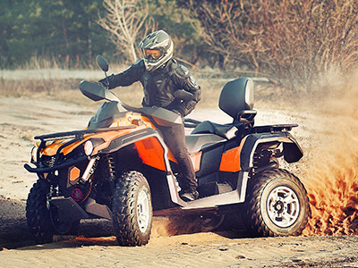 ATV speeding through dirt