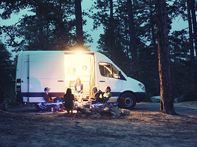 group of people camping in the woods