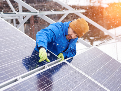 installing solar panels in the snow